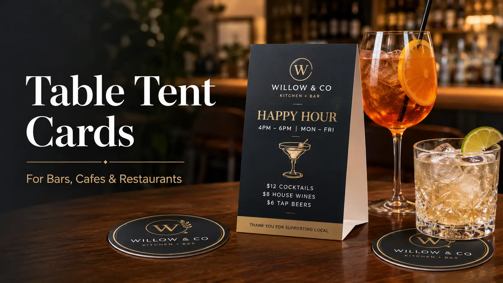 Elegant promotional graphic featuring a black and gold table tent card advertising happy hour, displayed on a restaurant bar beside two cocktails and matching branded coasters.