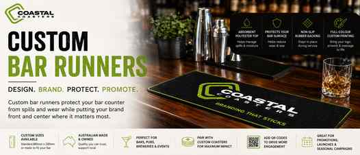 Coastal Coasters custom bar runner displayed on a bar counter with branded artwork, drinkware and bar tools, showcasing custom printing for pubs, breweries, events and promotions.