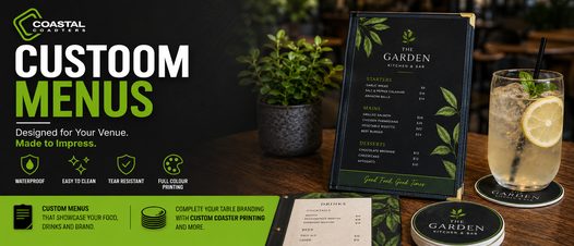 Coastal Coasters custom menus displayed in a restaurant setting with green and black branding, featuring a printed food and