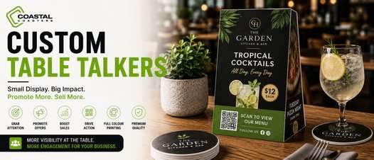 Coastal Coasters custom table talker displayed on a restaurant table with branded coasters and a drink, promoting cocktails, QR menu access, and in-venue marketing.